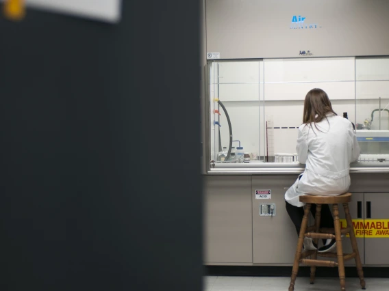 Student performing research in a laboratory.