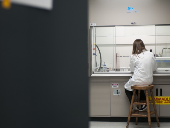 Student performing research in a laboratory.